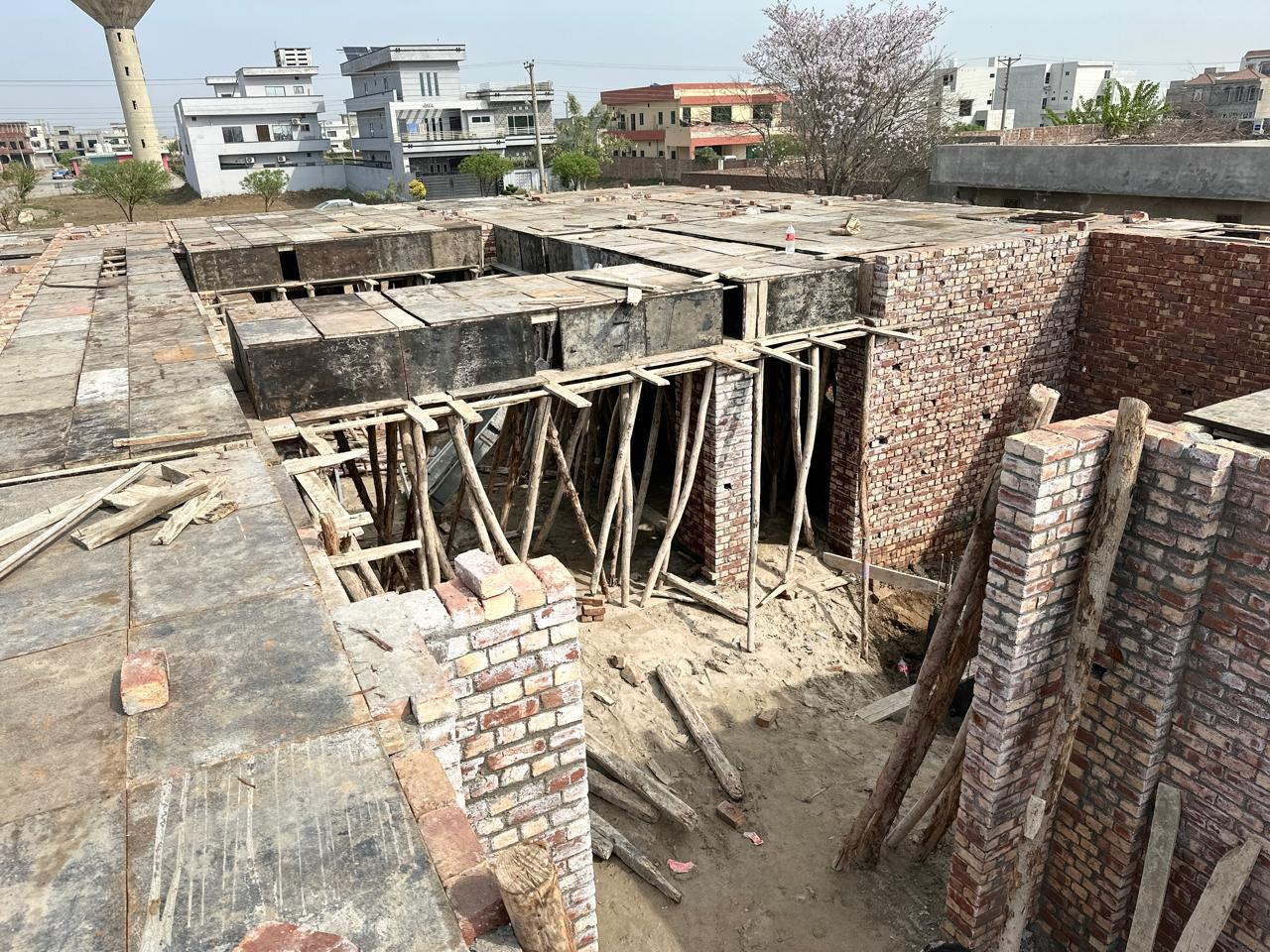 Rooftop slab formwork on a Ghazi Construction site in Lahore